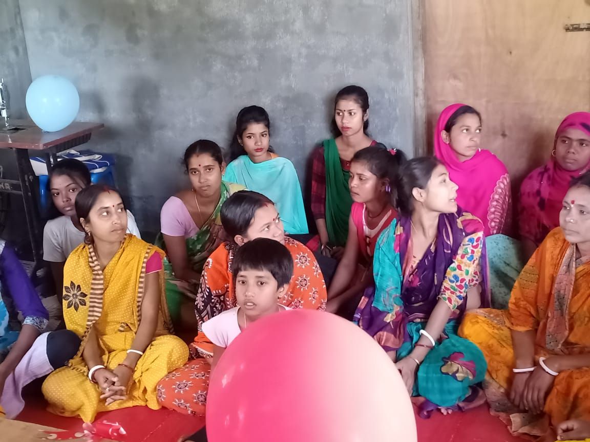 Tailoring instruction at the Assam training center